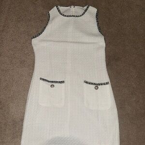 Elegant White Sleeveless Dress with Black Trim